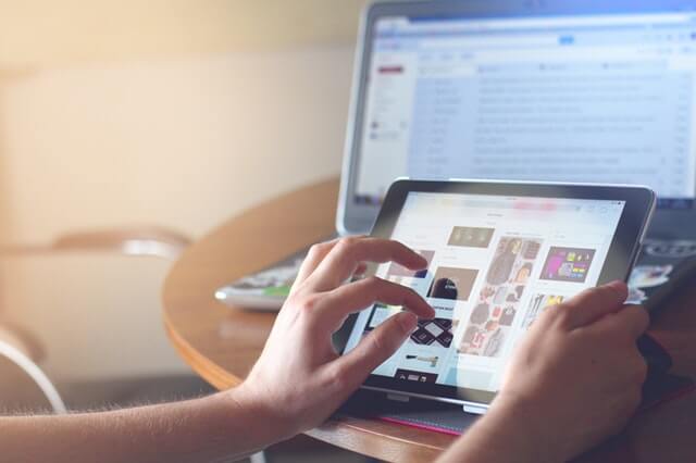 person holding tablet